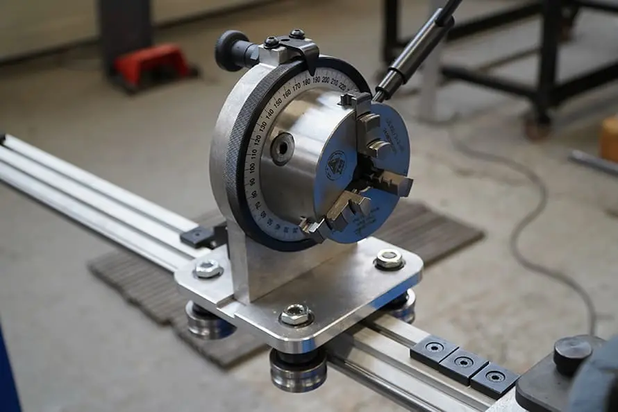 Moving arm with plane of bend indicator