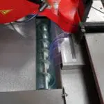 Bianco DS CNC 1R Bandsaw blade cleaning brush removing metal chips and debris to ensure precise cutting and extend blade life.