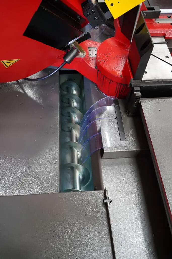 Bianco DS CNC 1R Bandsaw blade cleaning brush removing metal chips and debris to ensure precise cutting and extend blade life.