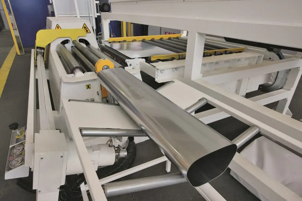 Close up of an elliptical piece of material which has been rolled on an MG CNC Bending Rolls