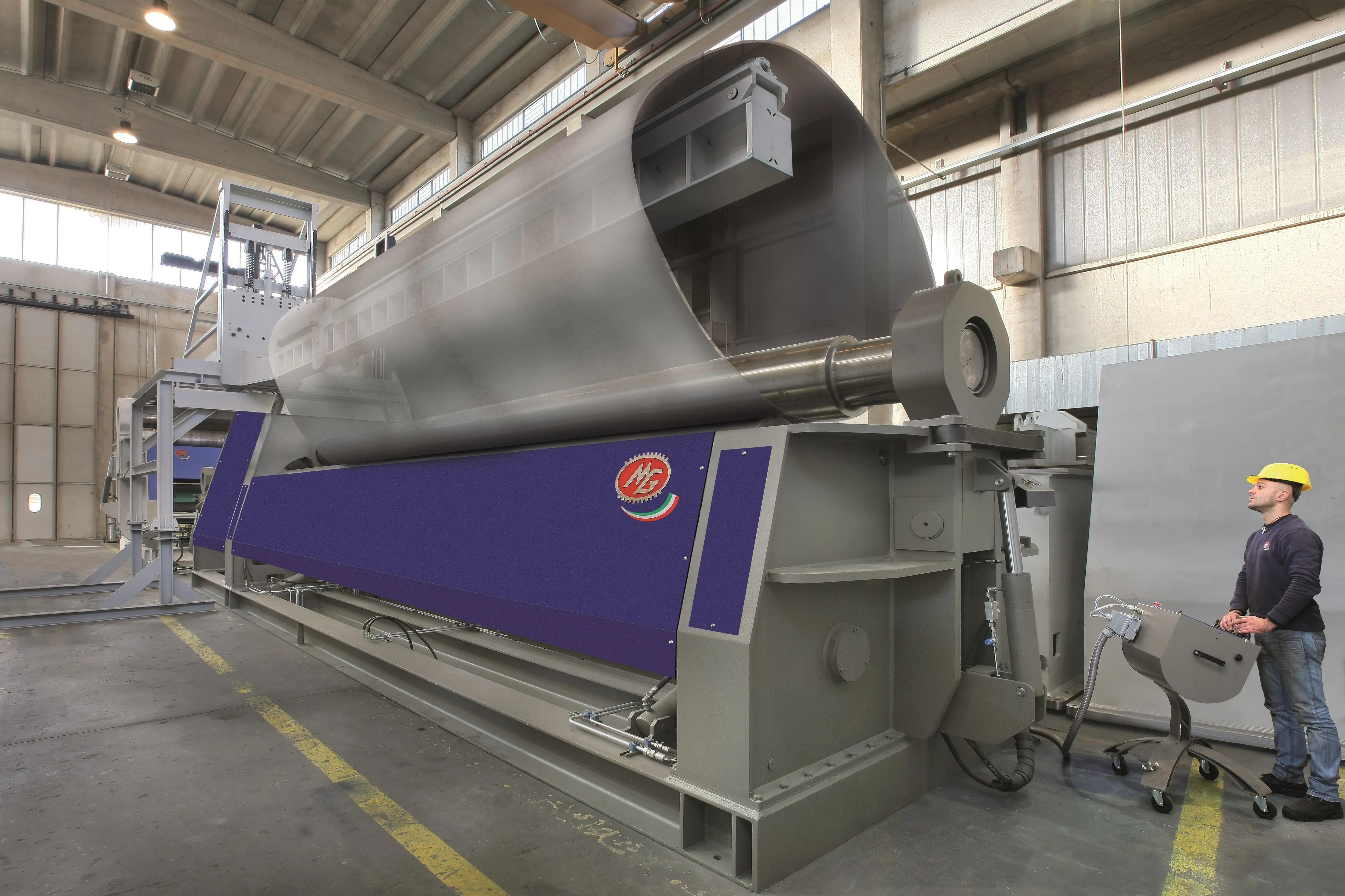 Large oval sheet metal being rolled on a MG CNC Bending Rolls