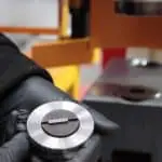 Image of someone safely removing a punch on a steelworker