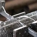 Image of metalworking saw blade cutting through solid tube