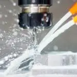 Image of coolant nozzles putting coolant on the cutting area