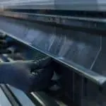 Image of hands adjusting top tooling on a pressbrake