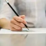 Image of person working out calculations