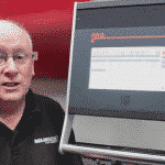 An engineer demonstrating how to use the ESA S630 Touch Control Panel