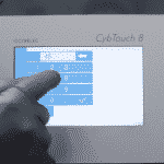 Image of a hand operating the Cybtouch 8 Control Panel