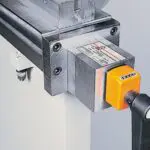 A Manual Crowning Device with a handle and simple visual read out system.