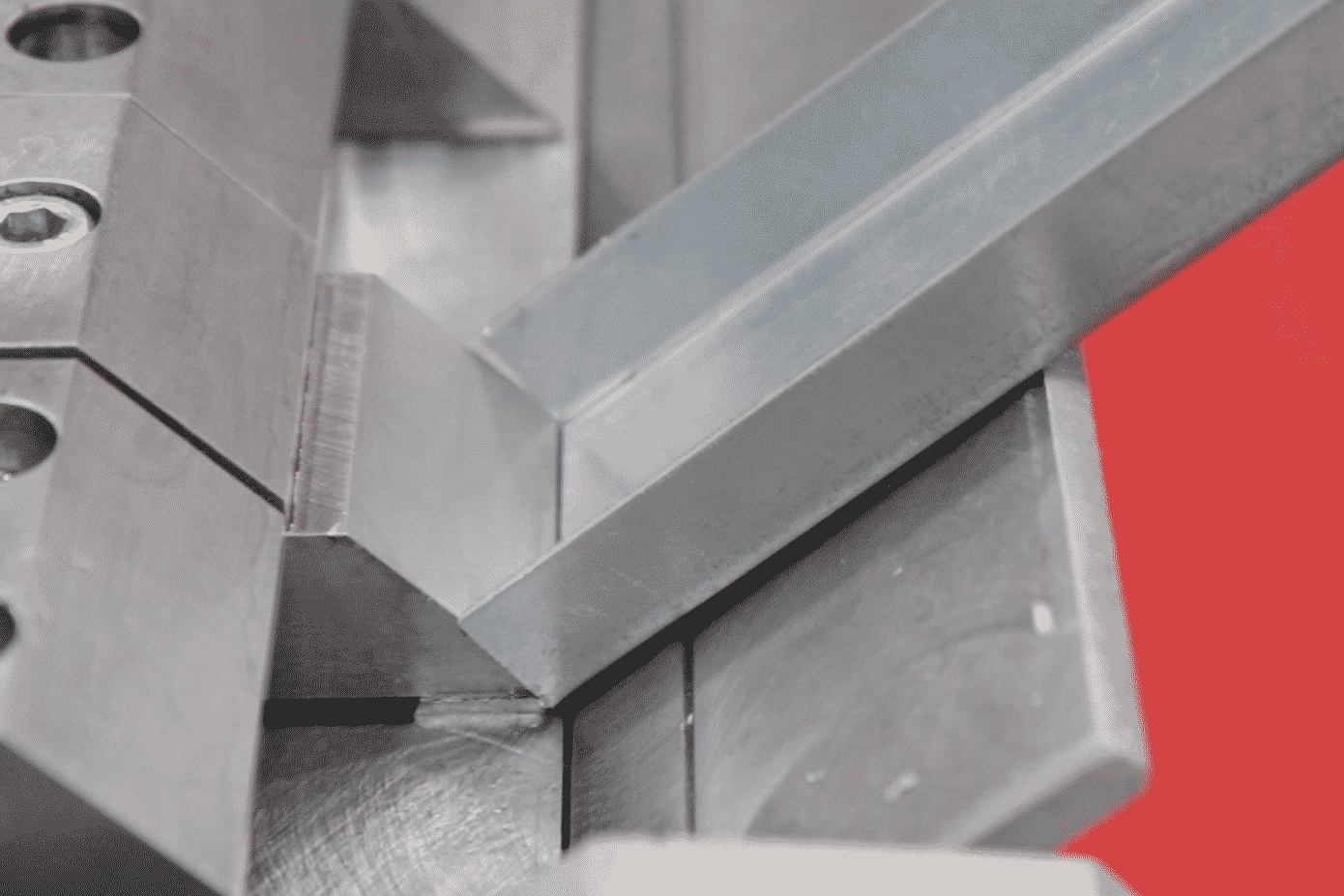 Meet-the-machines-The-box-and-pan-folder Image of a box section being folded on a Morgan Rushworth Box and Pan Folder