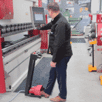 Image of an operator bringing down the top beam on a Morgan Rushworth Press Brake