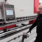 Front view of a Morgan Rushworth Press Brake lowering the top beam