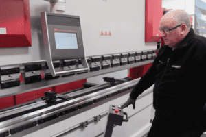 Front view of a Morgan Rushworth Press Brake lowering the top beam