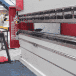 Image of the press brake beam being lowered and referenced