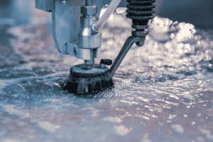 Close up of the waterjet head cutting metal