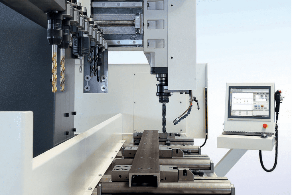 Side view down the bed of a Bauer Bohrmax Drill and Mill Line