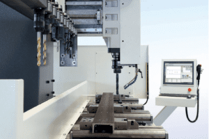 Side view down the bed of a Bauer Bohrmax Drill and Mill Line