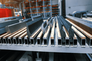 A selection of different press brake toolings displayed on racking