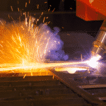 Detail of the plasma cutting head cutting metal