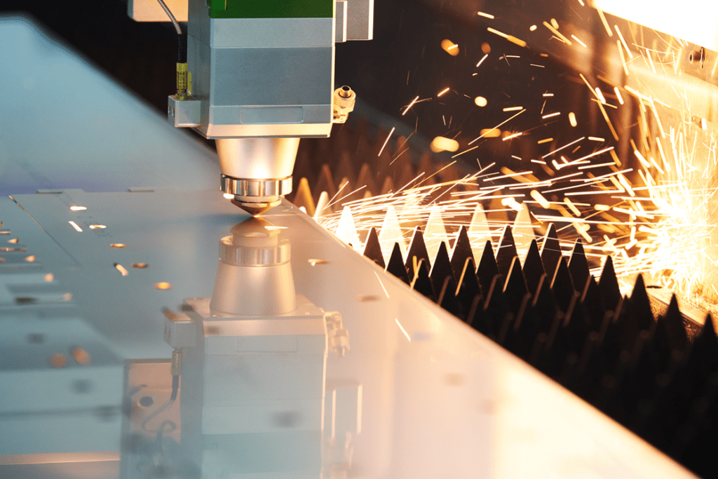 Close up image of the Raytool cutting head cutting metal on a Fibre Laser