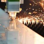 Close up image of the Raytool cutting head cutting metal on a Fibre Laser