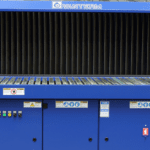 Blue Vanterm industrial downdraft extraction bench with a slatted work surface, vertical filter backwall, and integrated control panel