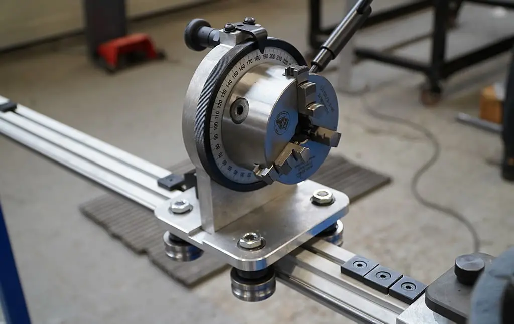 The adjustable angle chuck with a plane-of-bend indicator