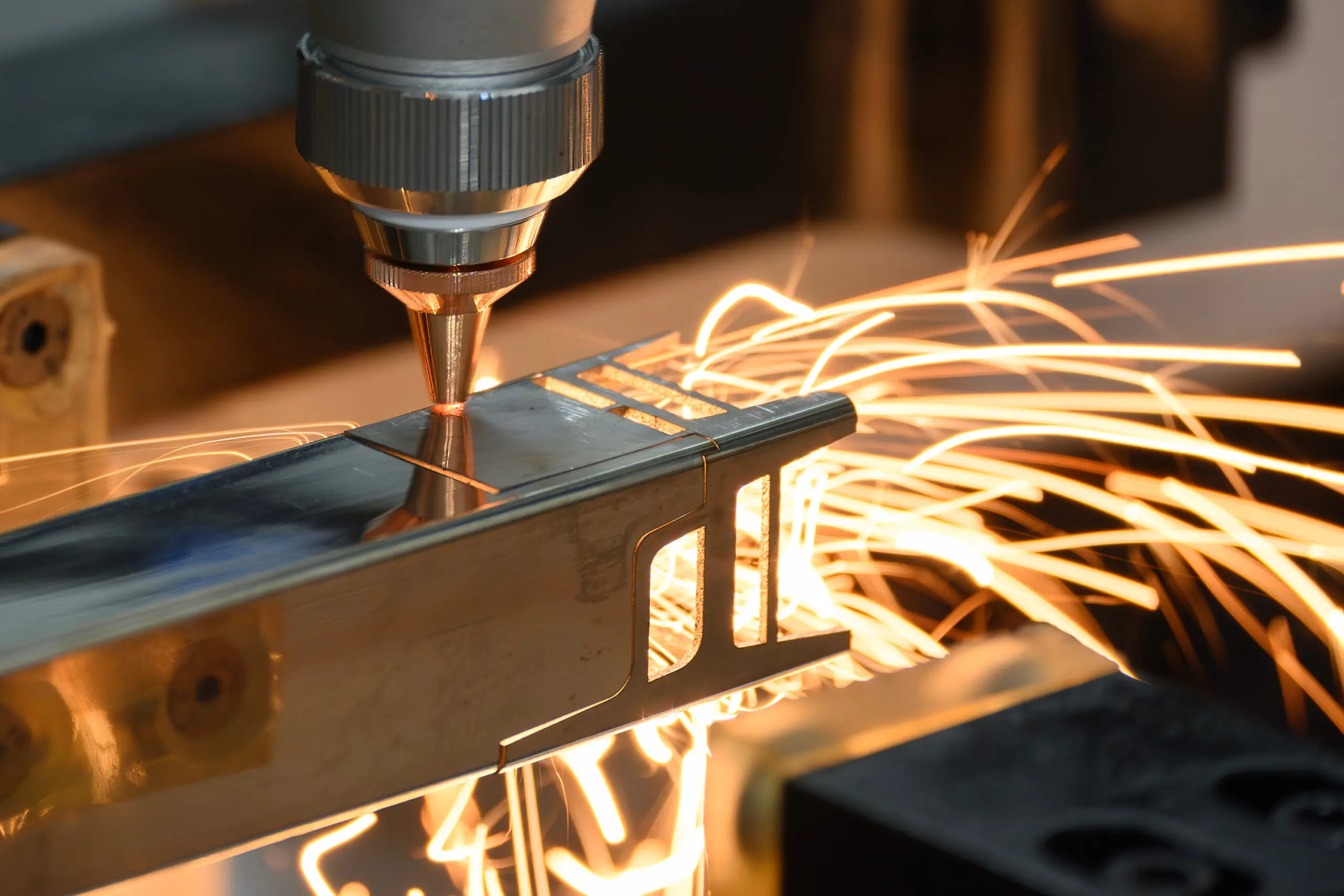 Close up scene the fiber laser cutting machine cut the square shape stainless steel tube with sparkling light. Close up of a Tube Laser Cutting