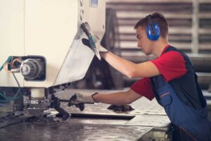 Image of engineer working a turret punch