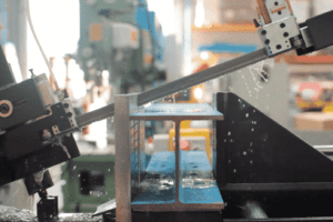 A Goldcut bandsaw blade cutting through a H beam of steel