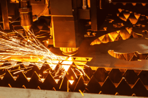 Close up of a Laser head cutting steel