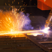 Detail of the plasma cutting head cutting metal