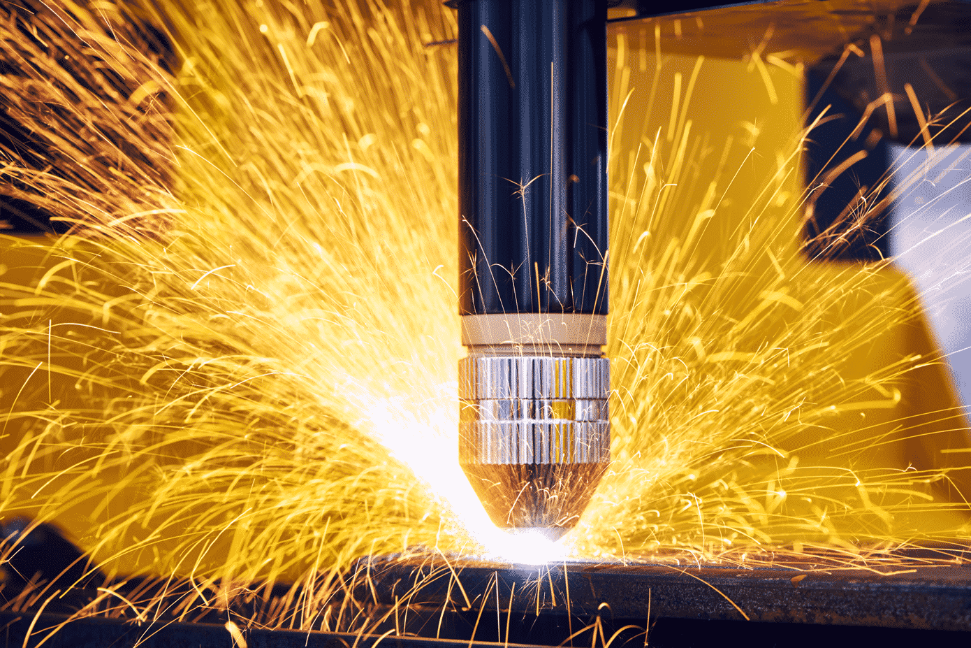 Detail of the plasma cutting head cutting metal